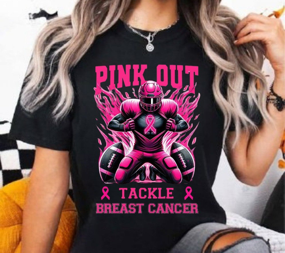 Person wearing a black t-shirt with pink breast cancer awareness design
