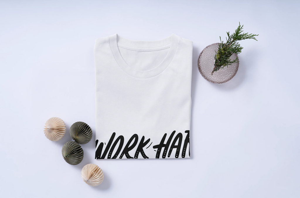 White t-shirt with 'WORK HARD STAY HUMBLE' text on a light gray background